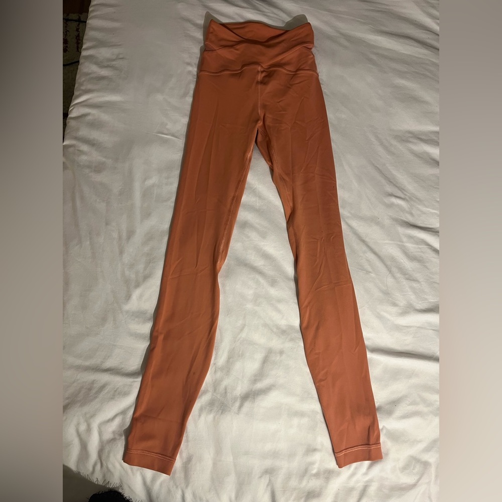 Pink/Salmon colors Lululemon Align leggings with cross detail Size 0, 28”